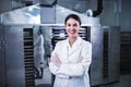 Smiling female engineer in front of Food Dryer Dehydrator Machine Royalty Free Stock Photo