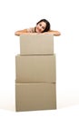 Portrait of woman standing behind cardboard box