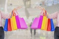 Portrait woman standing carry shopping bag in hand, fun and happy,background in mall,with concept of shopping and happiness women