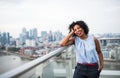 A portrait of a woman standing on a terrace in London. Copy space. Royalty Free Stock Photo