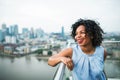 A portrait of a woman standing on a terrace in London. Copy space. Royalty Free Stock Photo