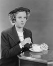 Portrait of woman stirring beverage