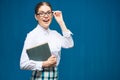 Portrait of woman student wearing glasses holding book. Royalty Free Stock Photo