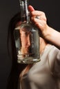 Portrait of woman in Studio, using a water bottle Royalty Free Stock Photo