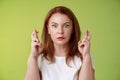 Stunned intense worried middle-aged redhead woman stare nervously awaiting important result implore dream come true