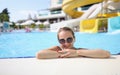 Portrait of woman in sunglasses in water park in pool Royalty Free Stock Photo