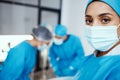 Portrait of woman, surgeon and operating room, hospital and healthcare emergency, surgery or medical clinic. Young Royalty Free Stock Photo