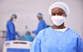 Portrait, woman and surgeon in operating room, hospital and surgery for medical emergency. Healthcare, african doctor Royalty Free Stock Photo