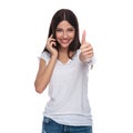 Portrait of woman talking on the phone making ok sign Royalty Free Stock Photo