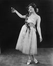 Portrait of woman toasting with glass