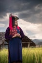 Portrait of Woman Tribal Lisu in Traditional Clothing in Rice Fields., Lifestyle of Hill Tribe Girl in The North of Thailand.,