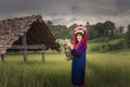 Portrait of woman tribal Lisu in traditional dress and jewelry costume in rice fields., Lifestyle of hill tribe girl in the north