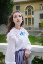 Portrait woman in vintage clothes on terrace of mansion