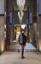 Portrait of woman in vintage dress posing at hotel hallway Royalty Free Stock Photo