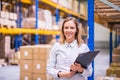 Portrait of a woman warehouse worker or supervisor. Royalty Free Stock Photo