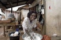 Portrait of woman washing clothes for her store