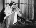 Portrait of woman wearing cowboy boots Royalty Free Stock Photo