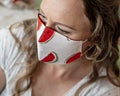 Portrait of woman wearing handmade cotton fabric face mask. Protection against saliva, cough, dust, pollution, virus, bacteria,