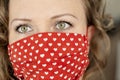 Portrait of woman wearing handmade cotton fabric face mask. Protection against saliva, cough, dust, pollution, virus, bacteria,