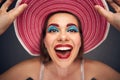 Portrait of woman wearing red summer hat.