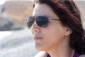 portrait of a woman wearing sunglasses and relaxing in the sun Royalty Free Stock Photo