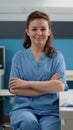 Portrait of woman working as medical assistant at desk