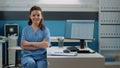 Portrait of woman working as medical assistant at desk