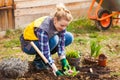 Portrait of woman working in garden in spring