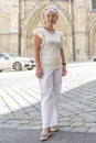 Portrait of a woman 60-65 years old in summer against a blurred background of ancient architecture of the Austrian city of Vienna, Royalty Free Stock Photo