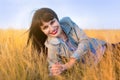 Portrait of a woman in the yellow steppe grass