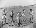Portrait of women digging in field Royalty Free Stock Photo