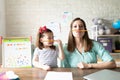 Mother and daughter enjoying homeschooling together Royalty Free Stock Photo