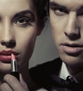 Portrait of a woman and man with lipstick