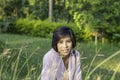 Portrait of Women with short hair brown skin Sitting on the grass