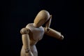 Wooden Mannequin Looking Sad And Depressed On Black Background Royalty Free Stock Photo