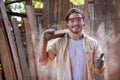 Portrait of woodworker or craftsman wearing safety goggles showing thumb up
