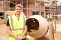 Portrait Of Worker On Building Site Mixing Cement