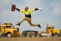 Portrait worker in construction helmet. Engineer builder foreman or repairman. Worker excited jump at building site