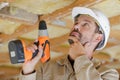 portrait worker drilling ceiling Royalty Free Stock Photo