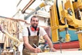 Portrait of a worker in a joinery at the workplace - woodworking