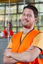 Portrait of a worker in orange protective vest