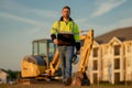 Portrait of worker small business owner. Construction worker with hardhat helmet on construction site. Construction