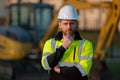 Portrait of worker small business owner. Construction worker with hardhat helmet on construction site. Construction