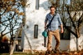 worker using leaf blower in garden, autumn details Royalty Free Stock Photo