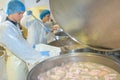 portrait workers preparing industrial meat