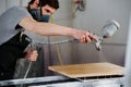 Carpenter is making furniture on order in a workshop Royalty Free Stock Photo
