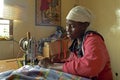 Portrait of working Kenyan woman in sewing room