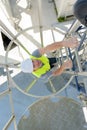 portrait workman climbing metal staircase Royalty Free Stock Photo
