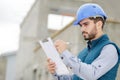 Portrait workman preparing estimate for work on house Royalty Free Stock Photo