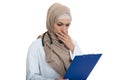 Portrait of worried muslim female Medical doctor holding paperclip isolated